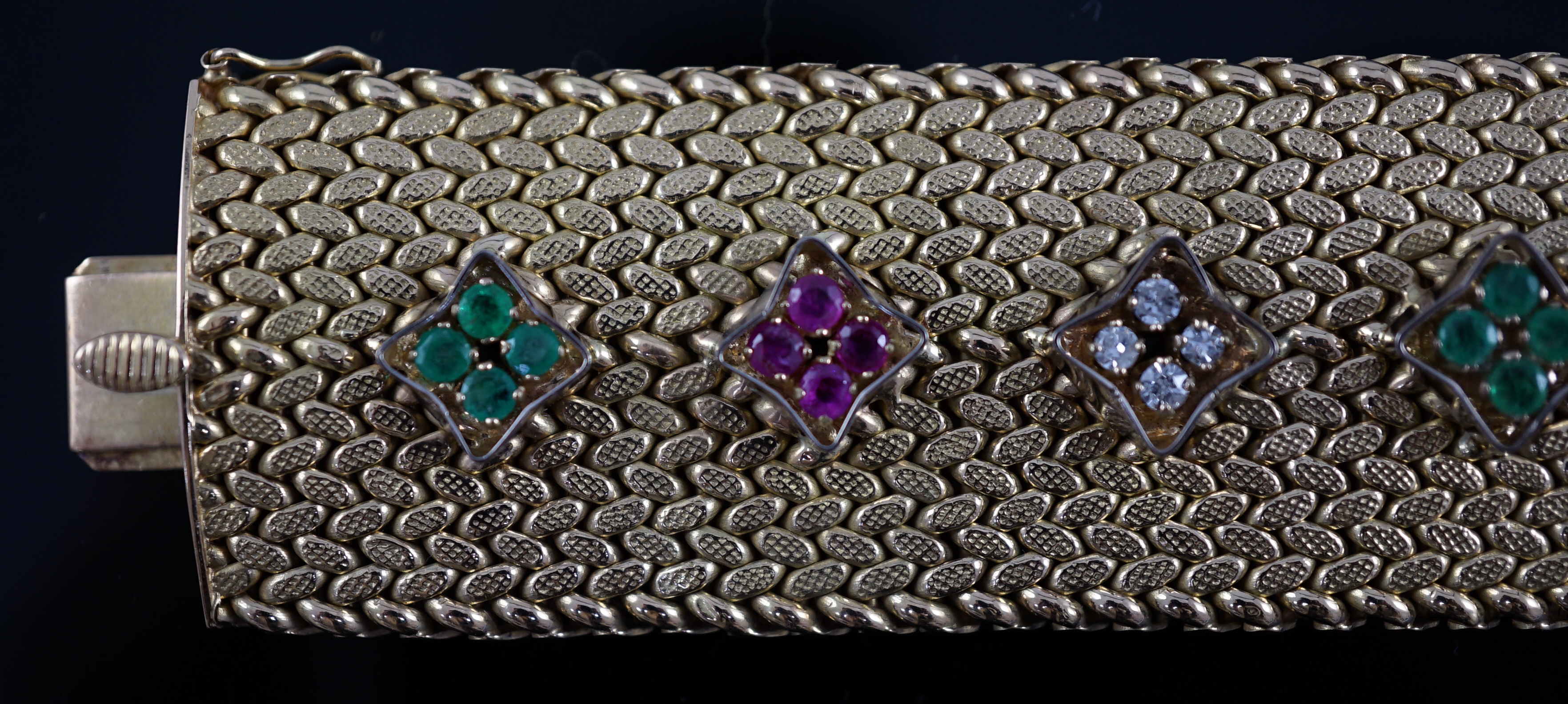 A mid 20th century Italian textured 18ct gold, ruby, emerald and diamond cluster set bracelet